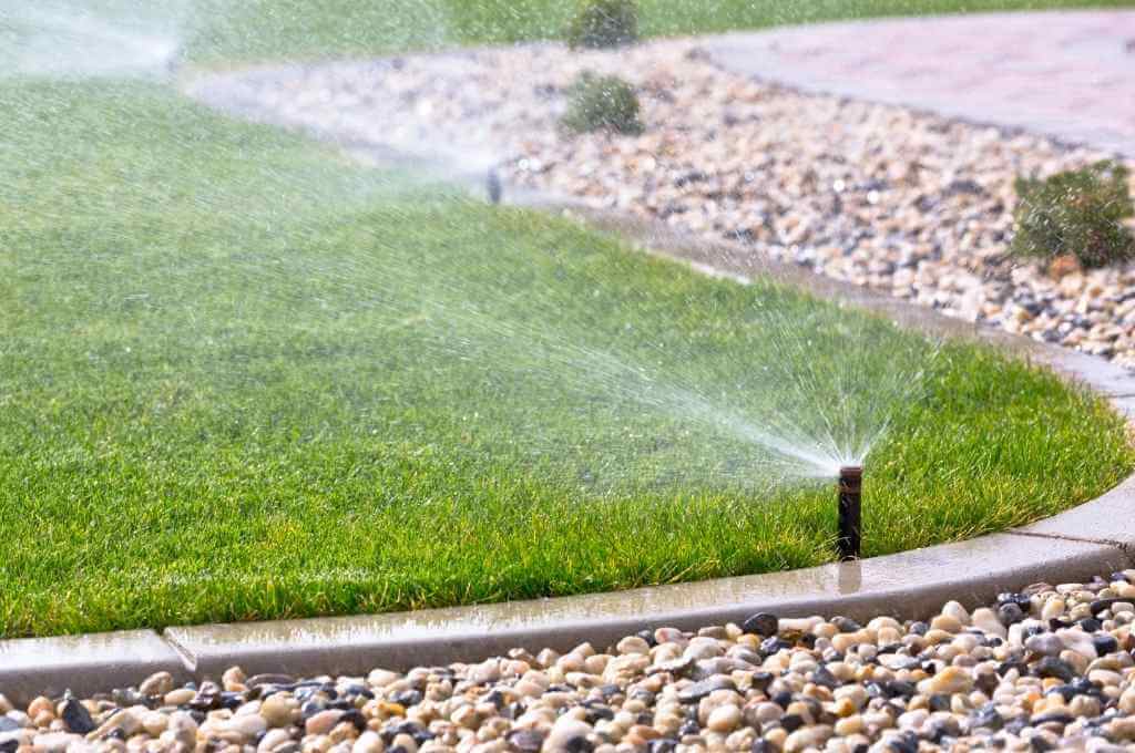 Fixed Spray Sprinklers Watering Lawn