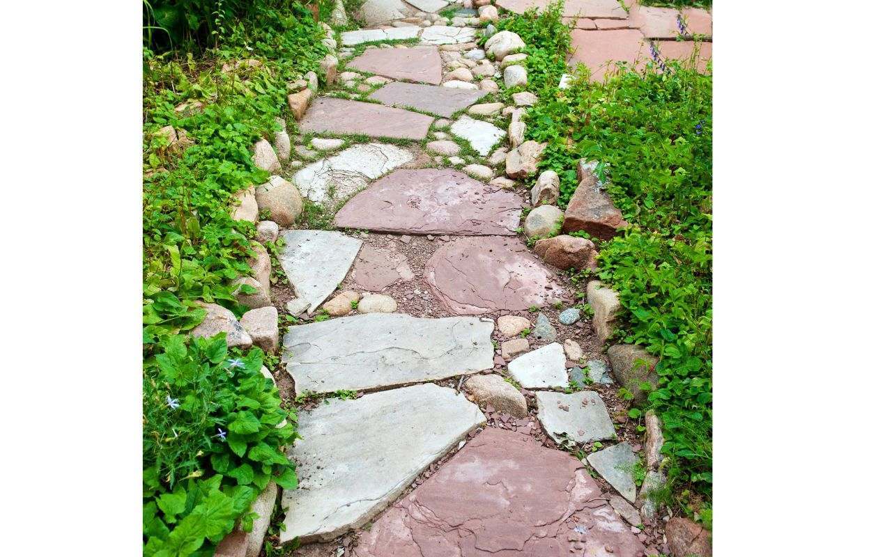 Flagstone patio with pathways in Kitsap County garden.